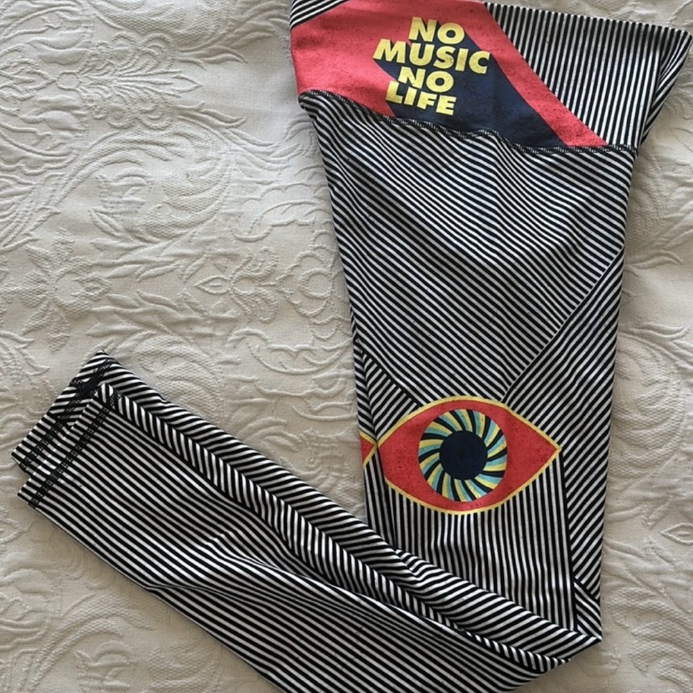 Niyama Sol Black and White Striped Womens Leggings with Red and Yellow Accents